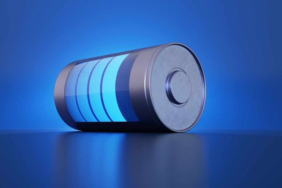 A battery on a blue background. 