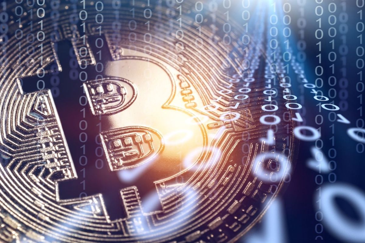 A Bitcoin with binary code.