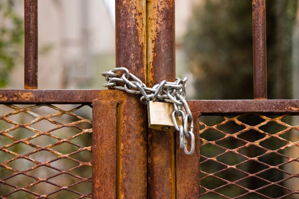 A gate with a lock on it.