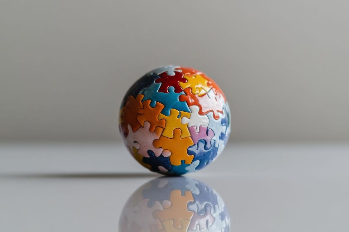 A globe made of colorful puzzle pieces.