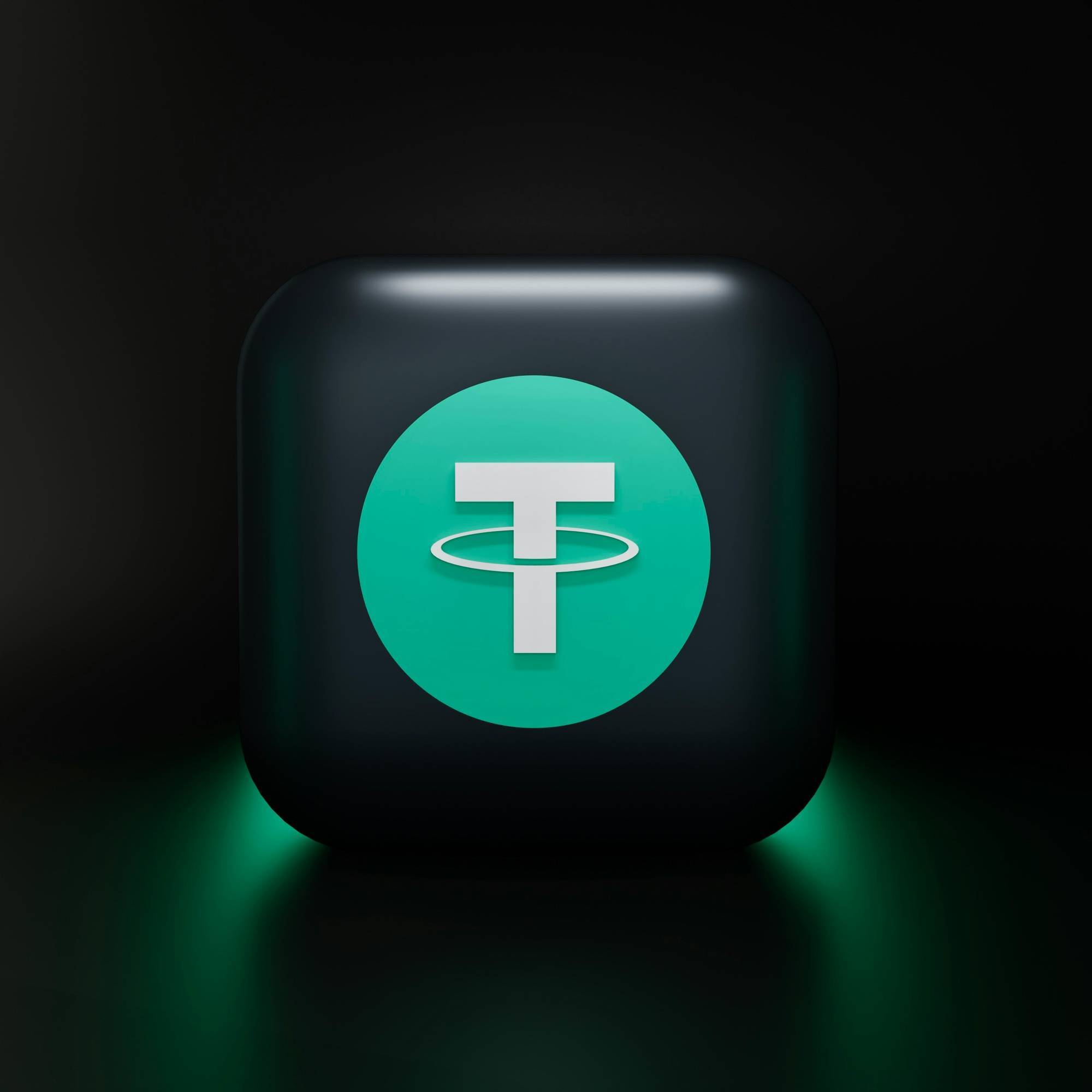 A glossy black square features a green circle with a white "T" and ring at the center.