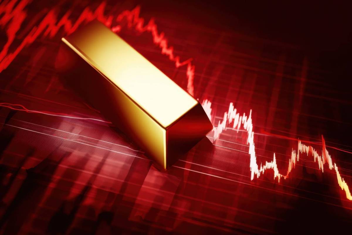 A gold bar is positioned over a red fluctuating stock market graph.