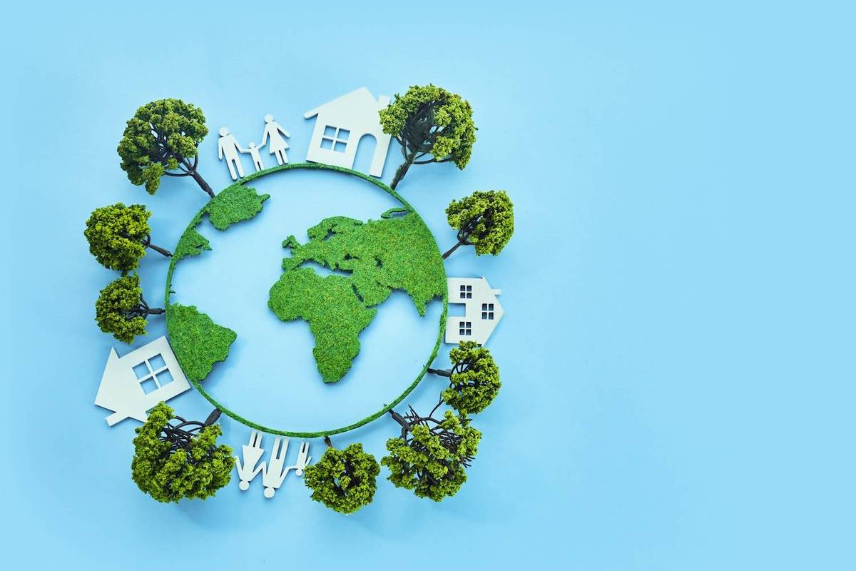 A green Earth with trees, houses and people over a blue background.