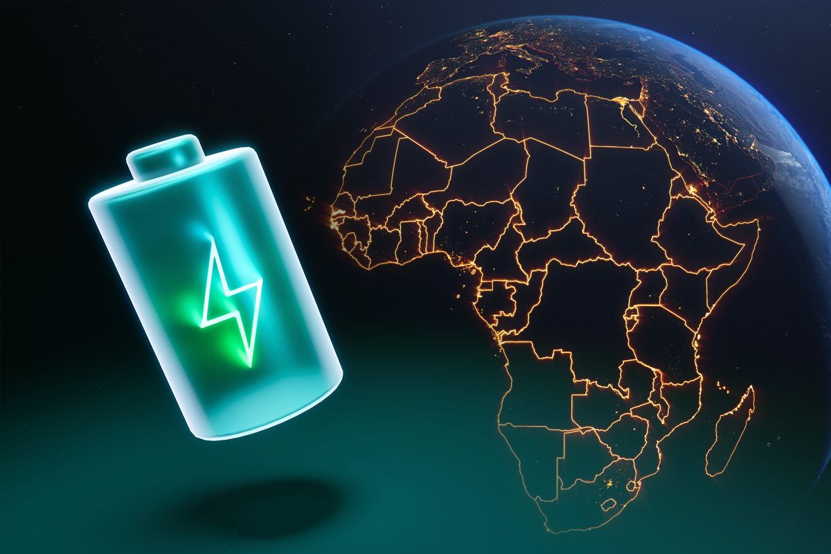 A green lithium battery next a lit up map of Africa.