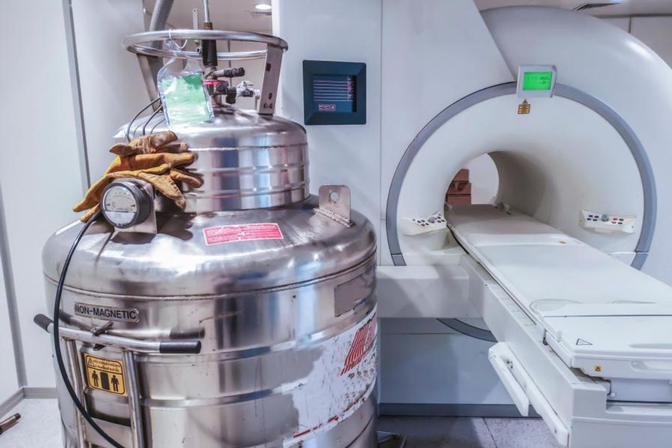 a helium tank beside an mri machine