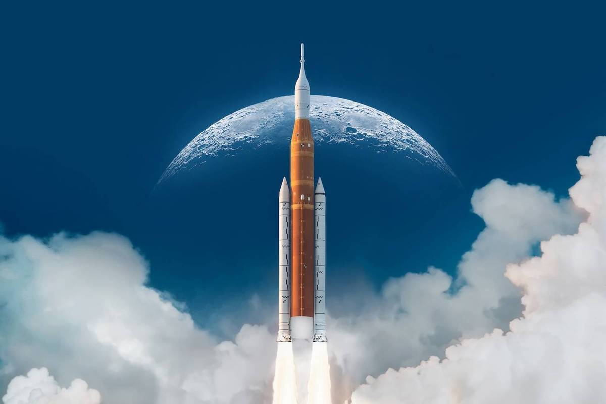 A large orange rocket launches amidst clouds with the moon looming in the blue sky above.
