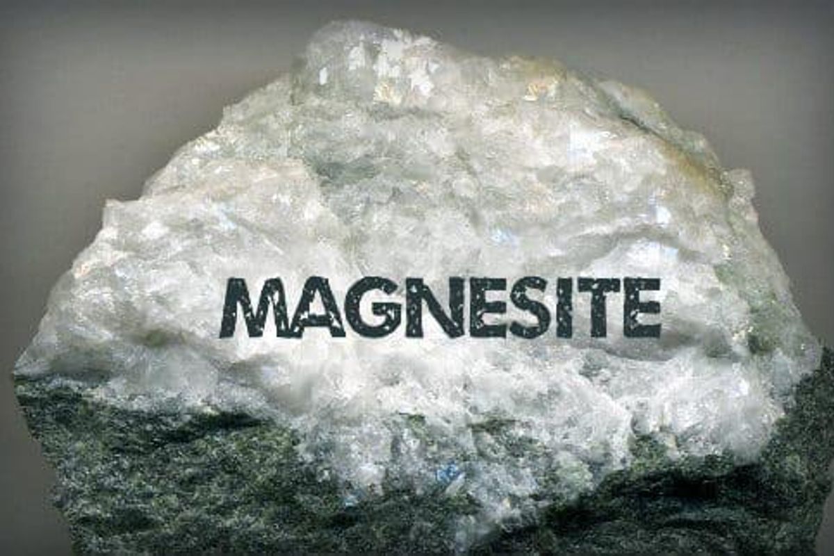 A piece of magnesite that says "magnesite" on the side.