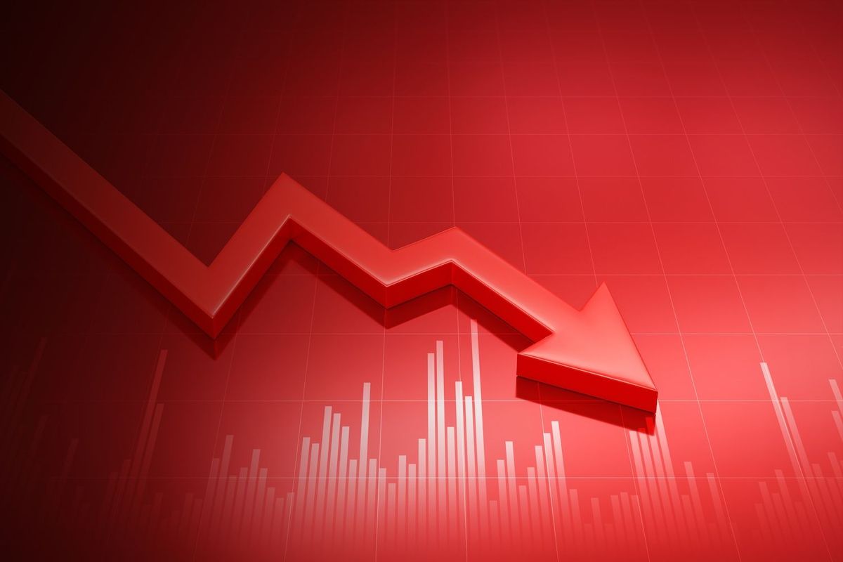 A red arrow trending down on a stock chart. 