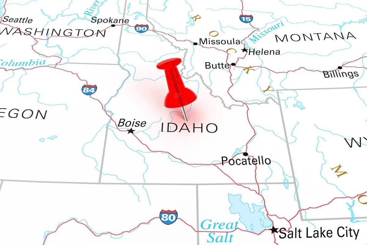 A red pushpin marks Idaho on a map showing surrounding states and cities; text reads: "IDAHO", "Boise", "Pocatello".
