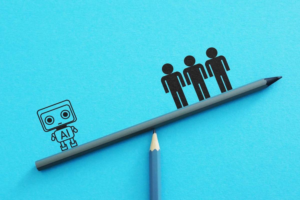 A robot labeled "AI" and three figures balance on a pencil seesaw against a blue background.