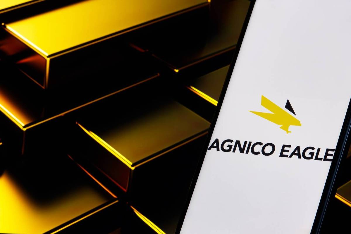 A smartphone displays the Agnico Eagle logo.