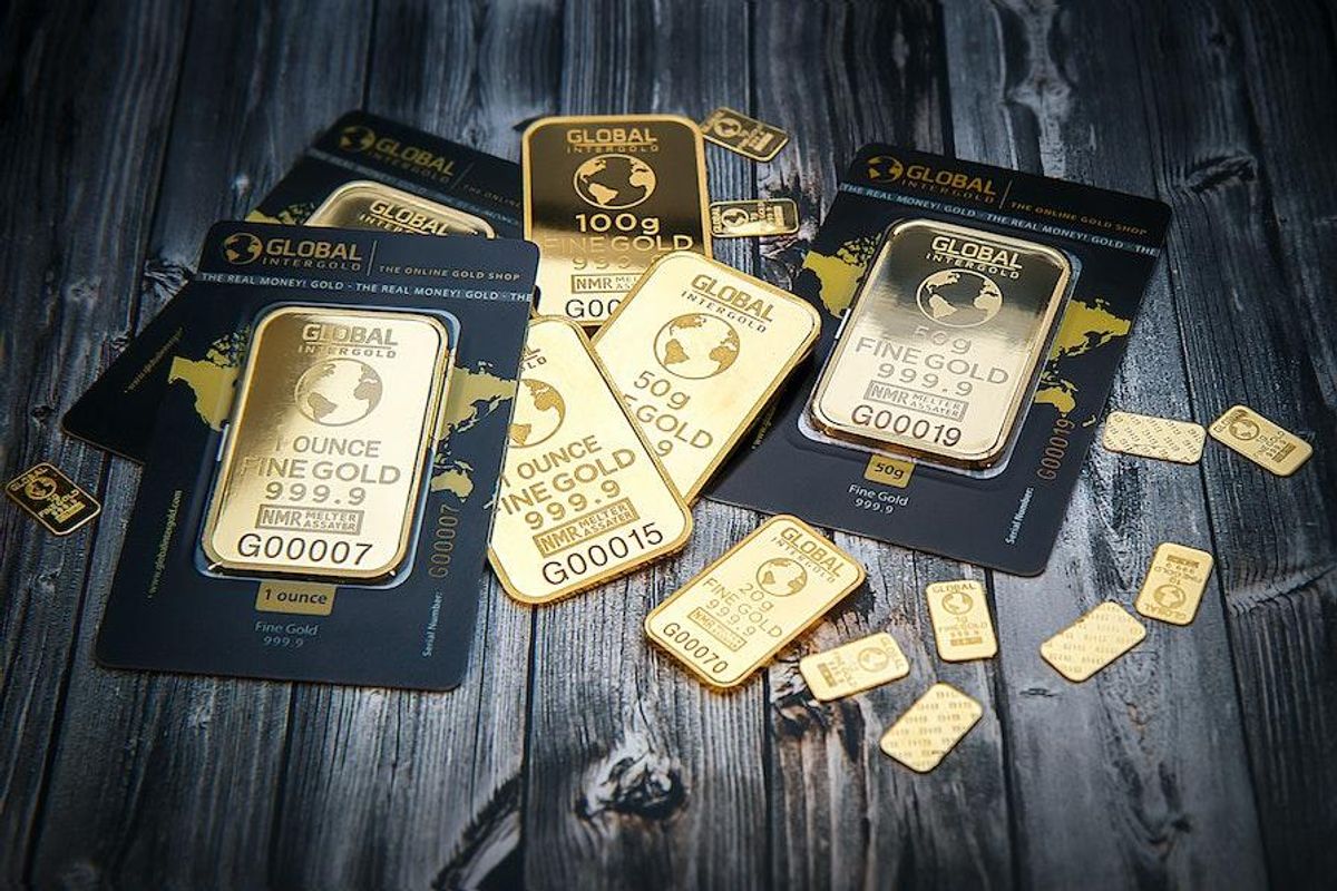 a variety of gold bars on a black table
