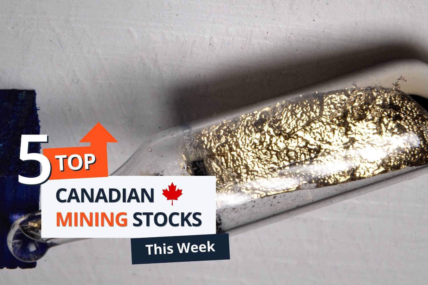A vial of gold minerals lies on a white surface; text reads: "5 Top Canadian Mining Stocks This Week."