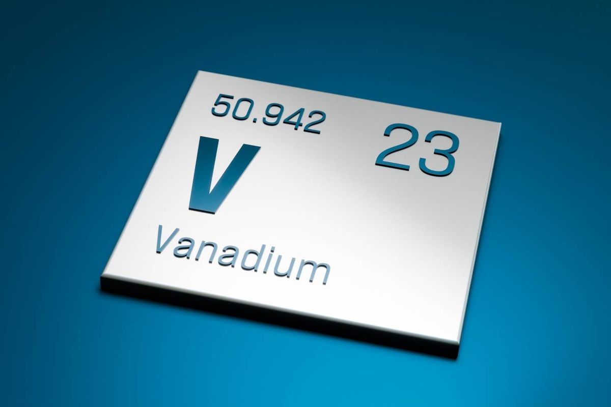 A white periodic table plaque on a blue background reads: 50.942, 23, V, Vanadium.