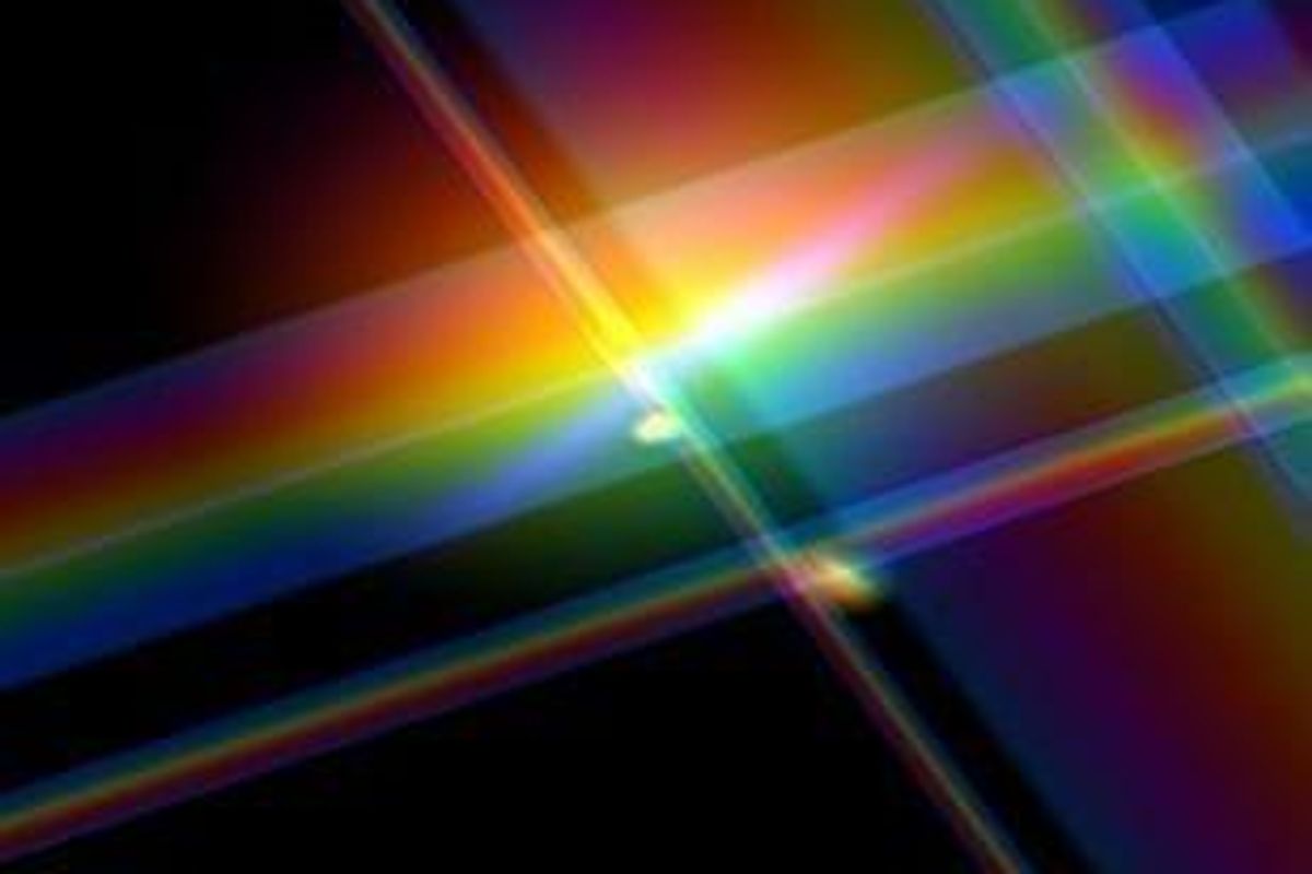 Abstract rainbow light beams intersect on a dark background.