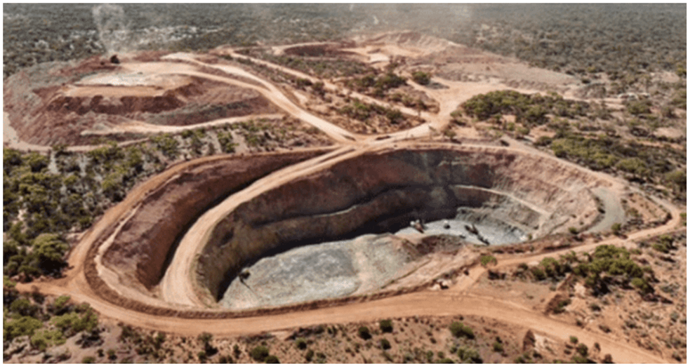 Aerial view of Maritana Minerals' open-pit mine surrounded by arid landscape and sparse vegetation.
