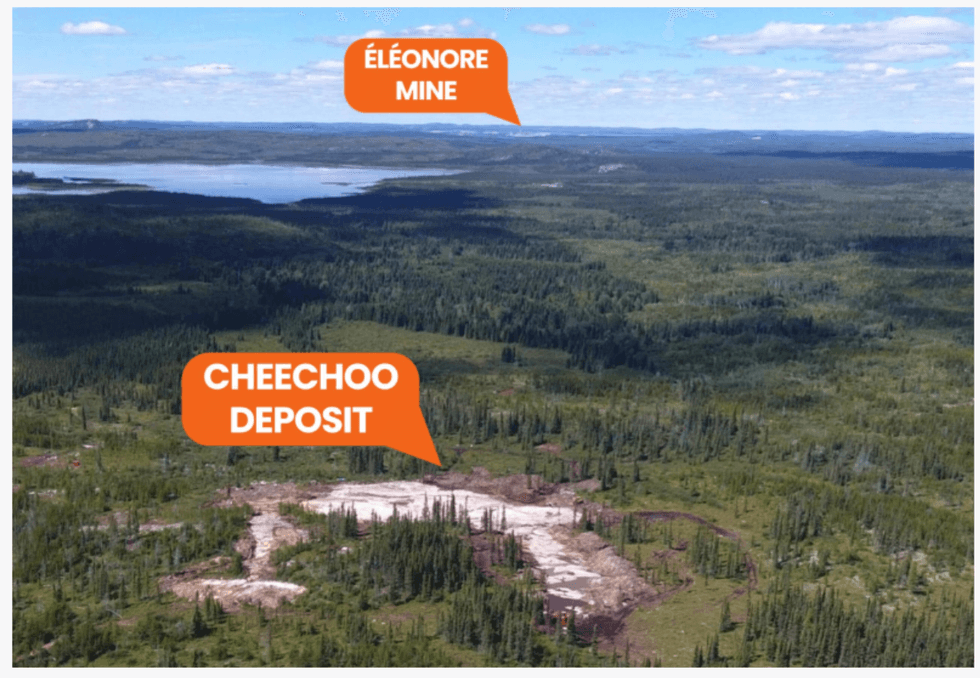 Aerial view of Sirios Resources' \u00c9l\u00e9onore Mine and Cheechoo Deposit in a vast forest landscape.