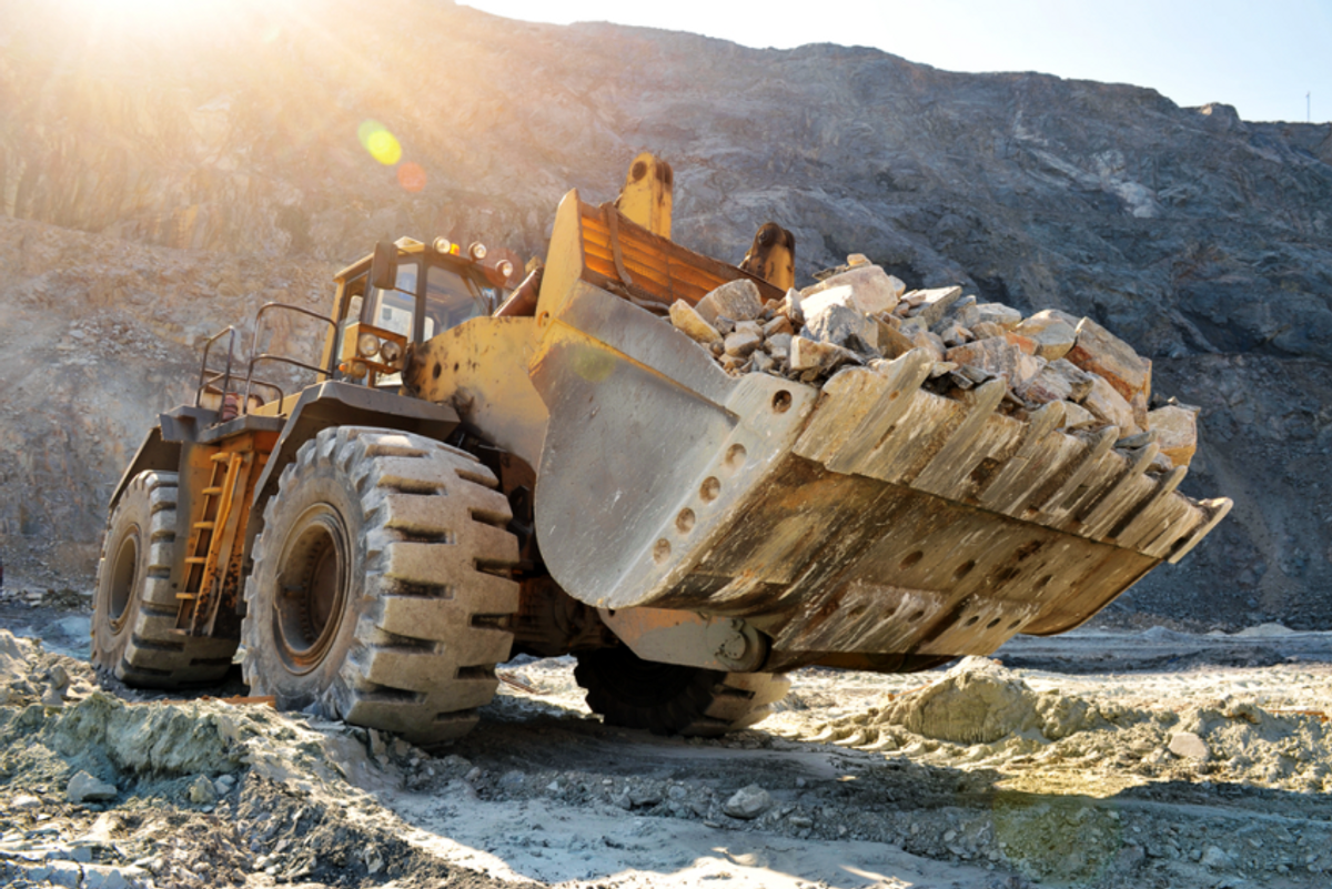 an earth mover working at a mine site
