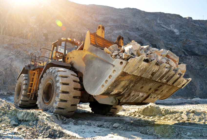 an earth mover working at a mine site