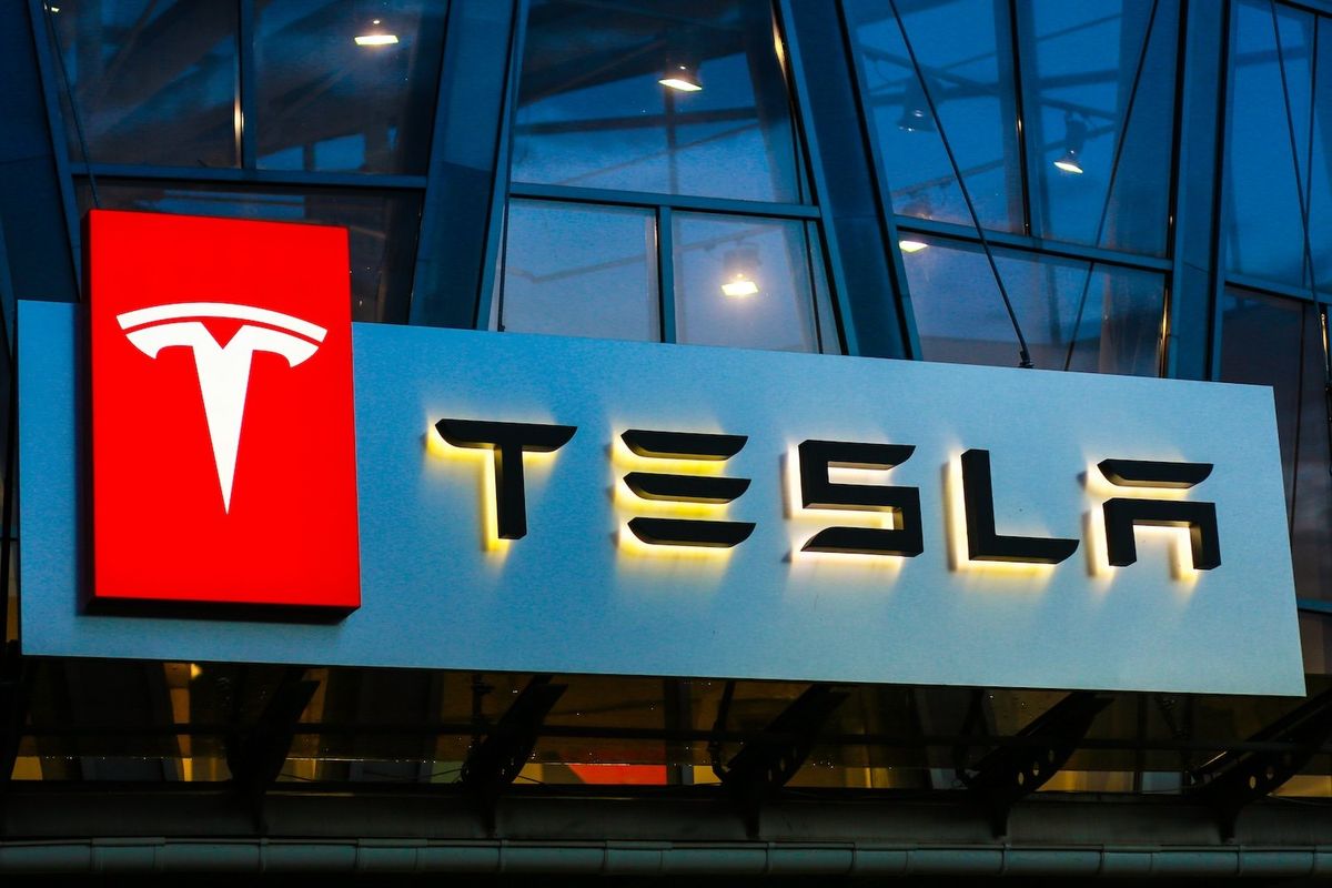 An illuminated Tesla sign. 