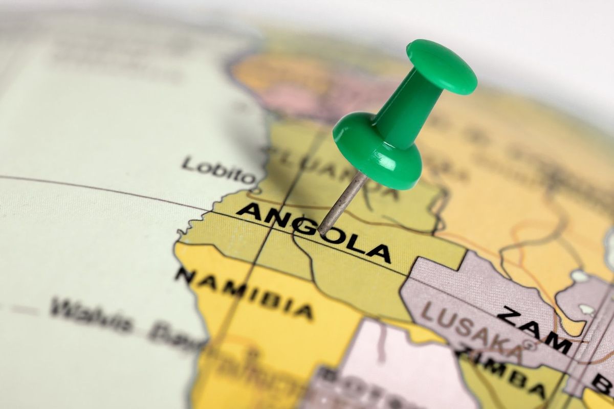 Angola on a map with a green push pin.