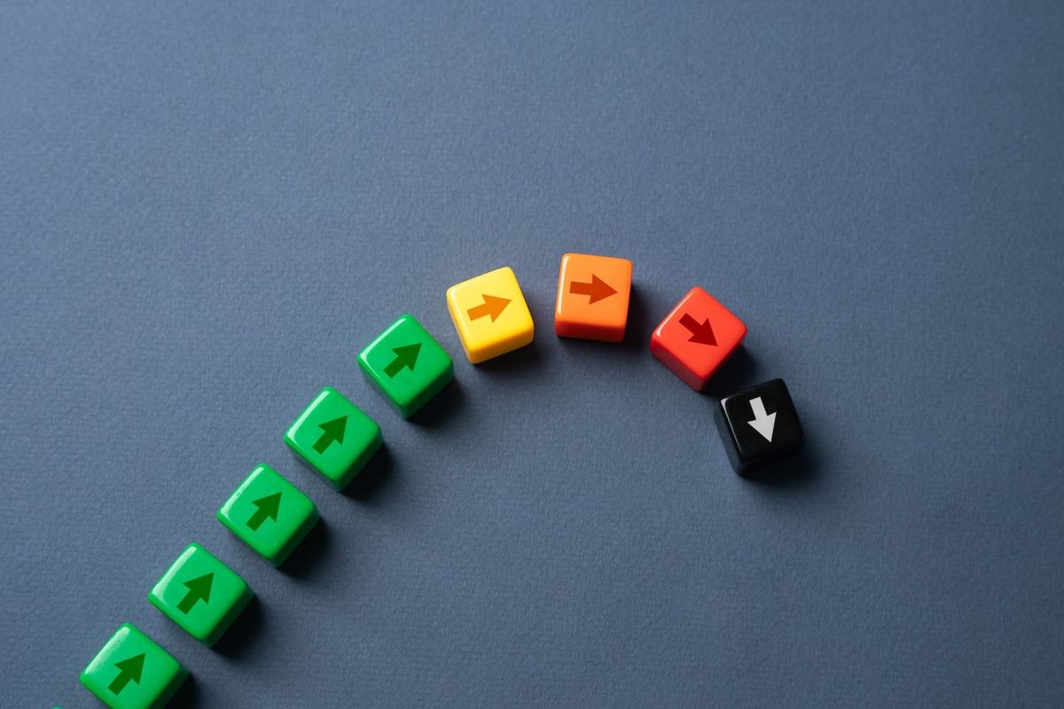 Arrows progressing in a downward fashion.