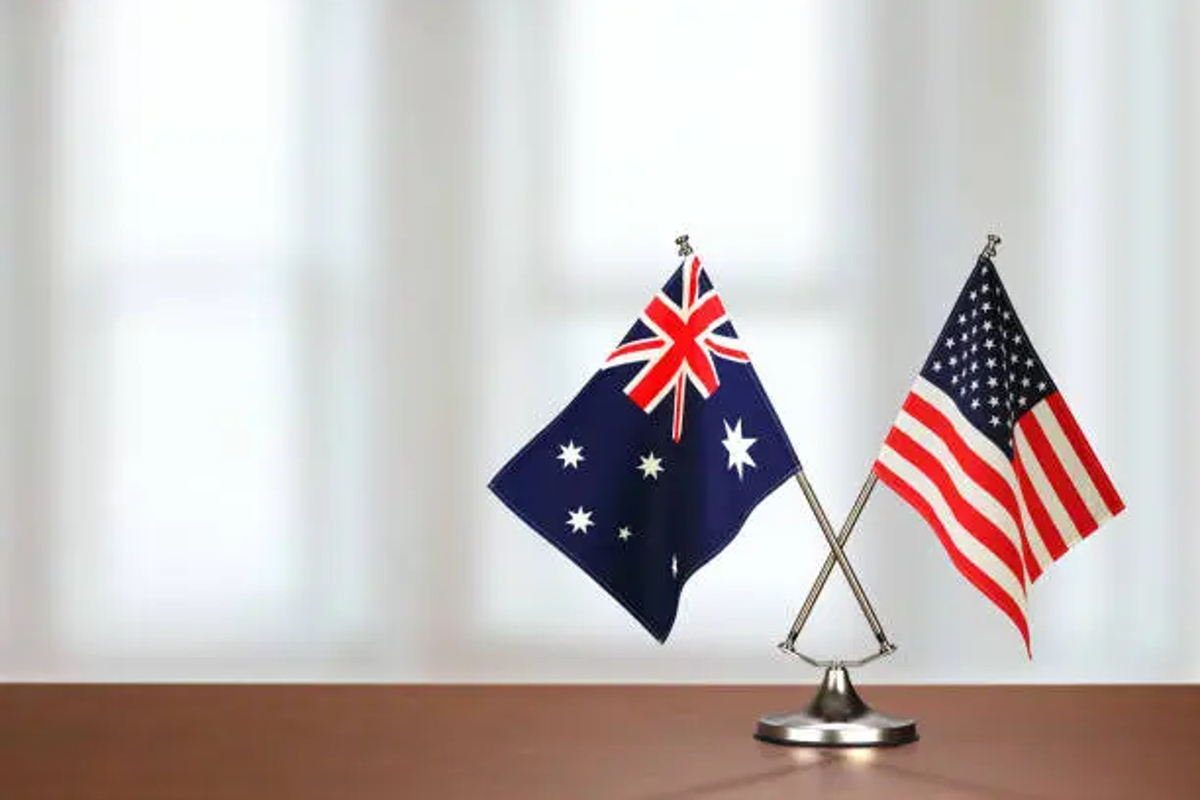 Australia and US flag on desk.