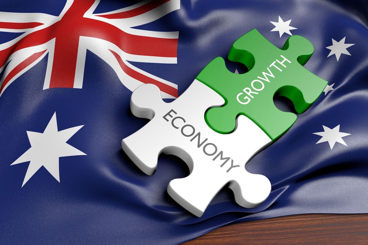 Australia flag with "growth" and "economy" puzzle pieces on it.