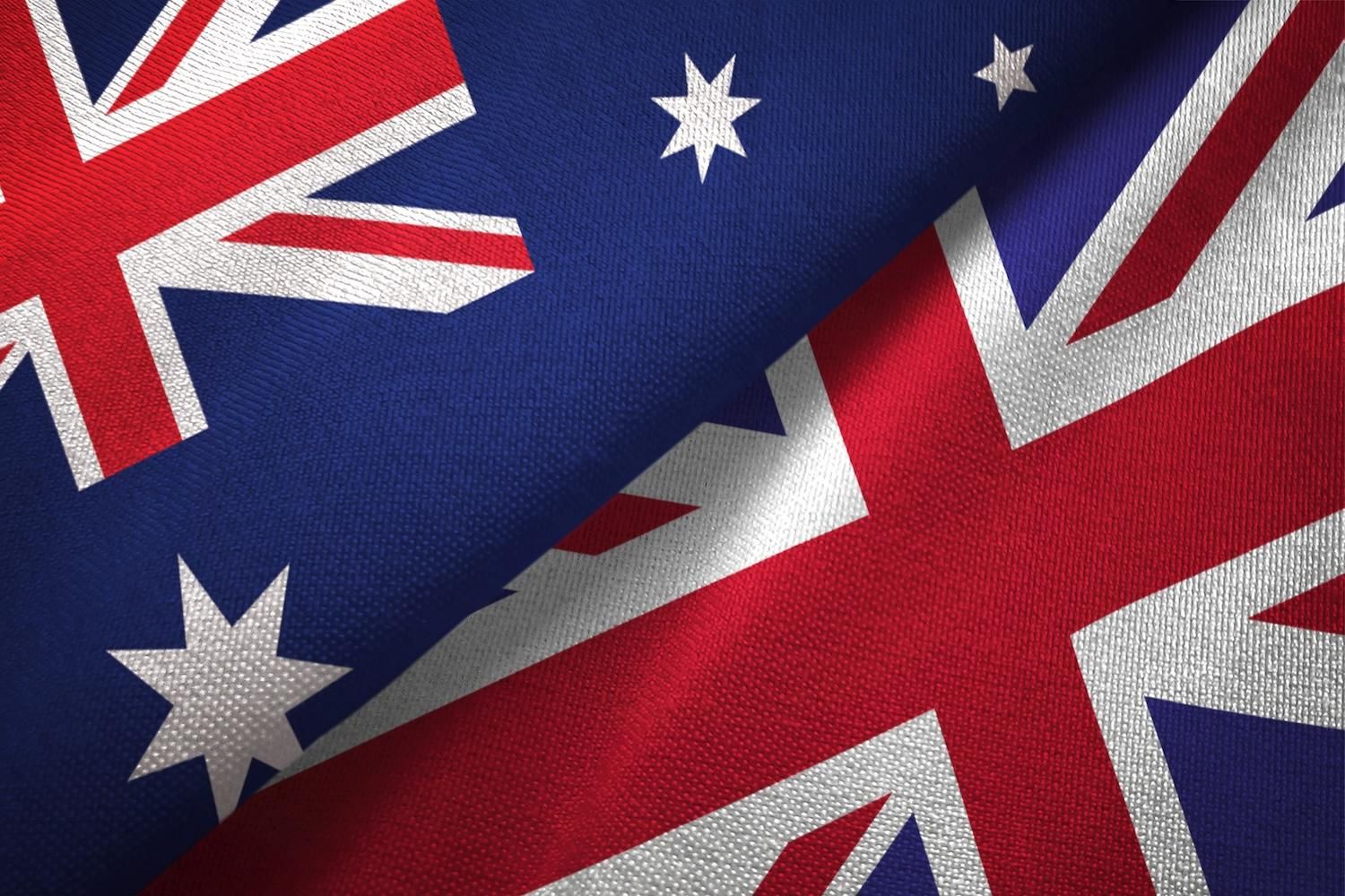 Australian and British flags overlapping closely.