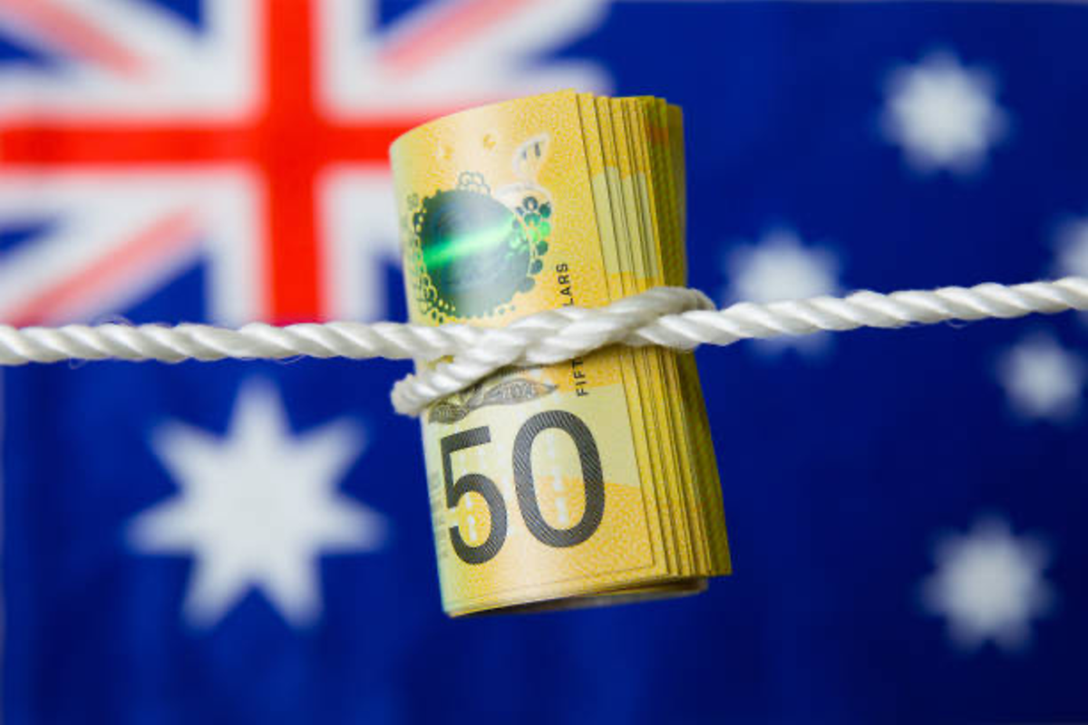 Australian dollars tied up with rope.