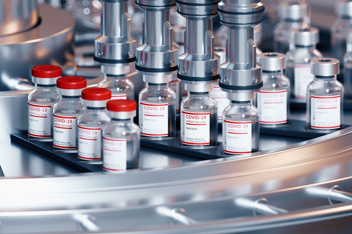 Automatic conveyor line with glass bottles of MRNA vaccine.