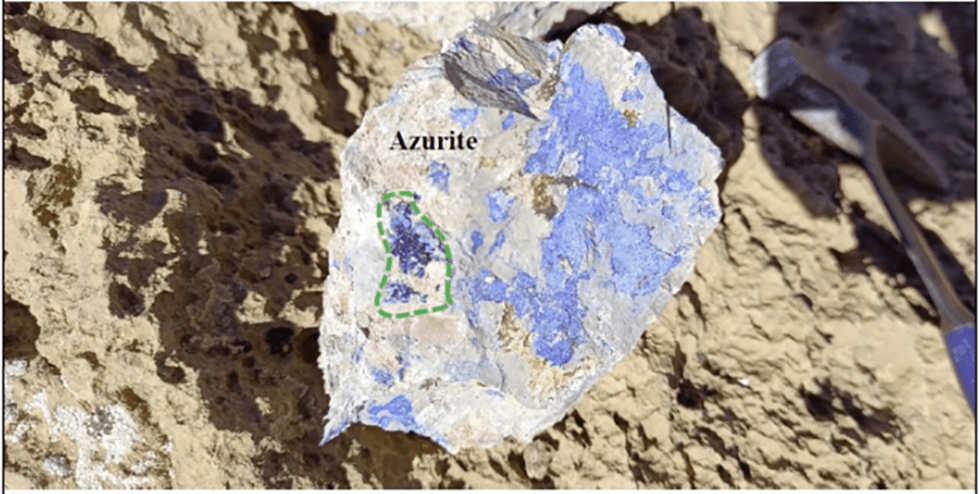 Azurite mineral on rocky surface, highlighted with a green dashed line. from Steadright Critical MIneral's Copper Valley project