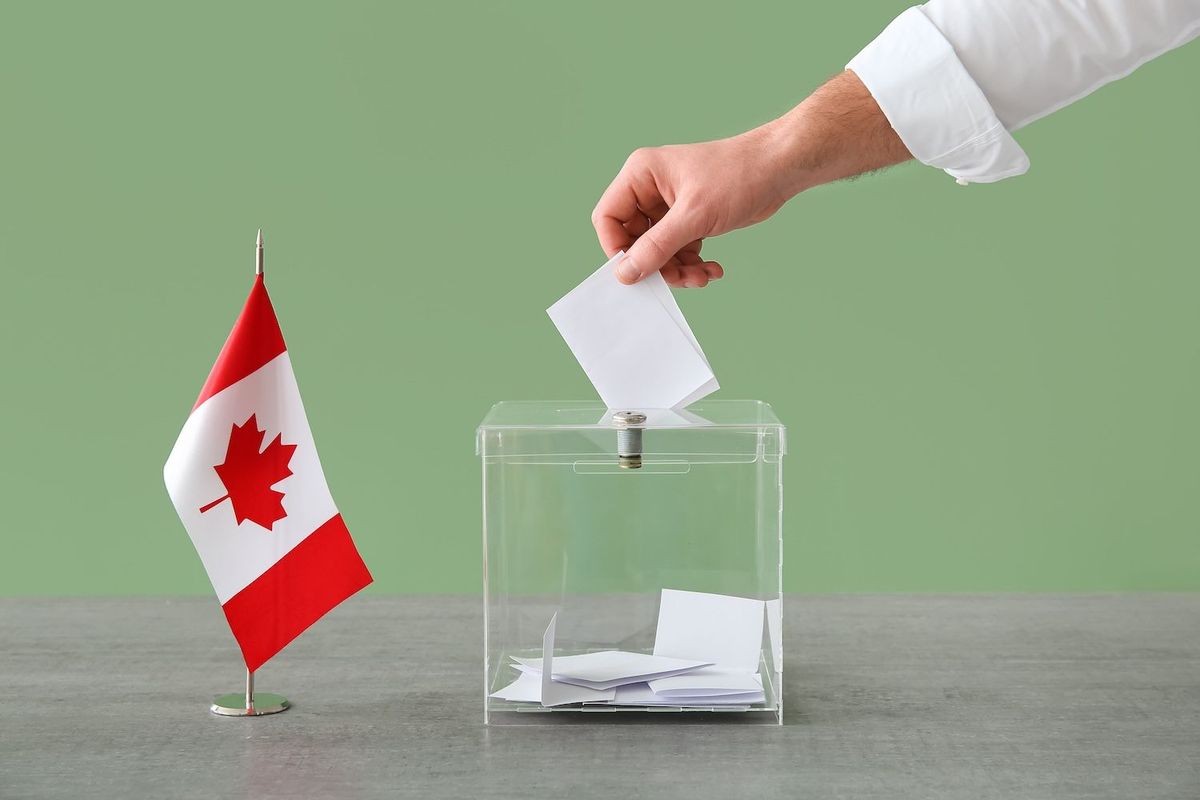 Ballot box and Canadian flag.