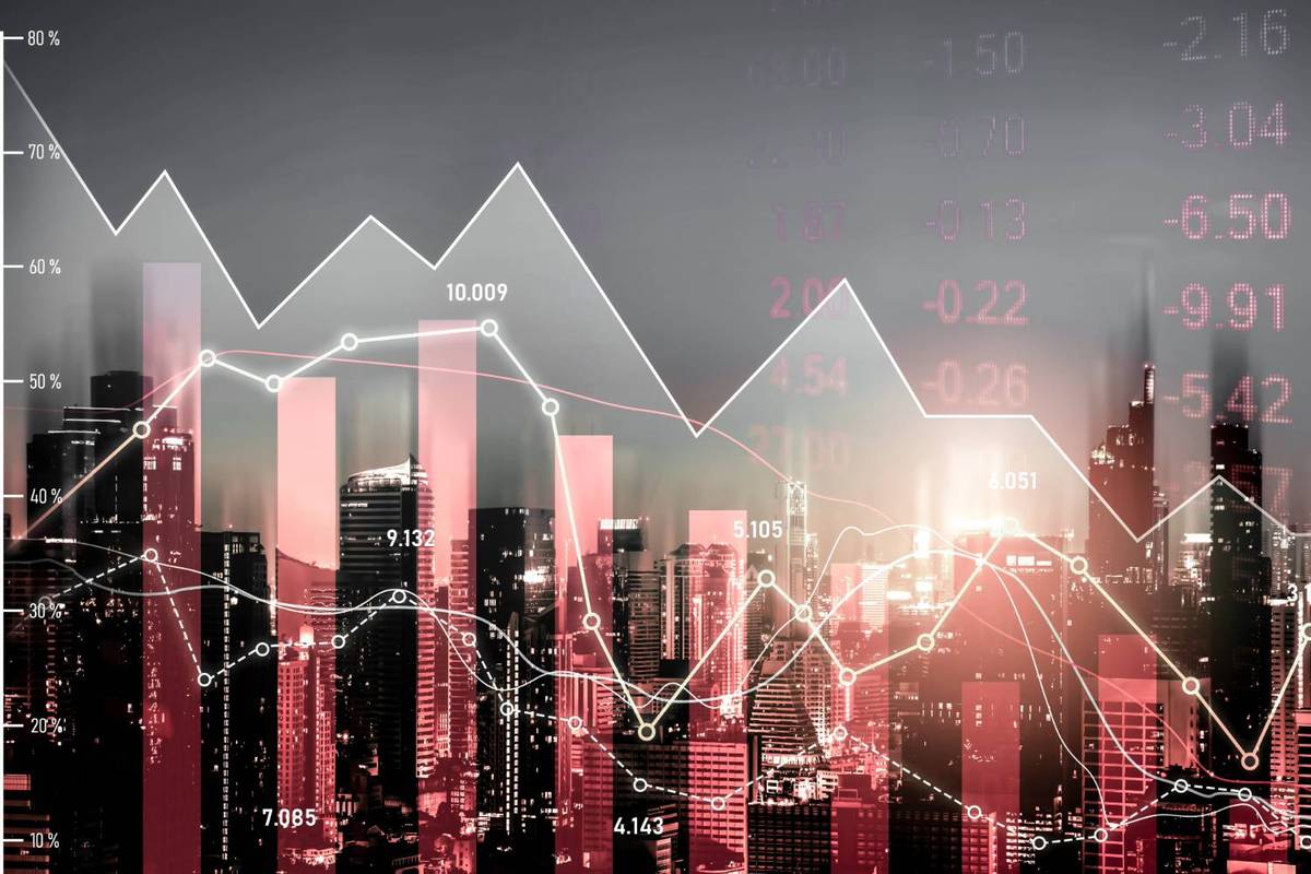 Bar graphs and line charts with numbers overlay a city skyline, fading into a gray sky.