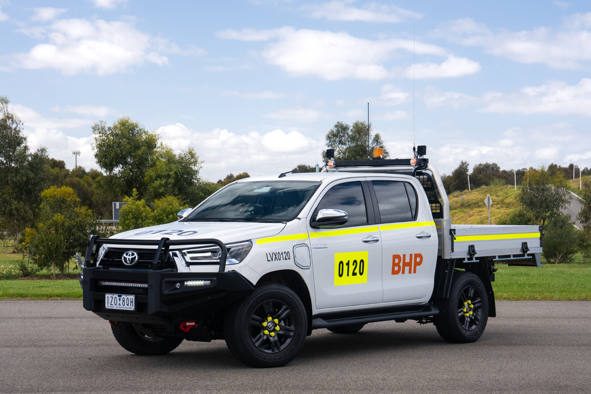 Battery-electric Toyota HiLux with BHP logo.