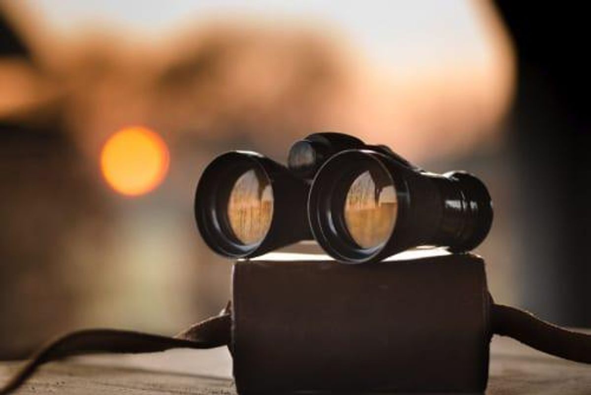 binoculars on top of a case