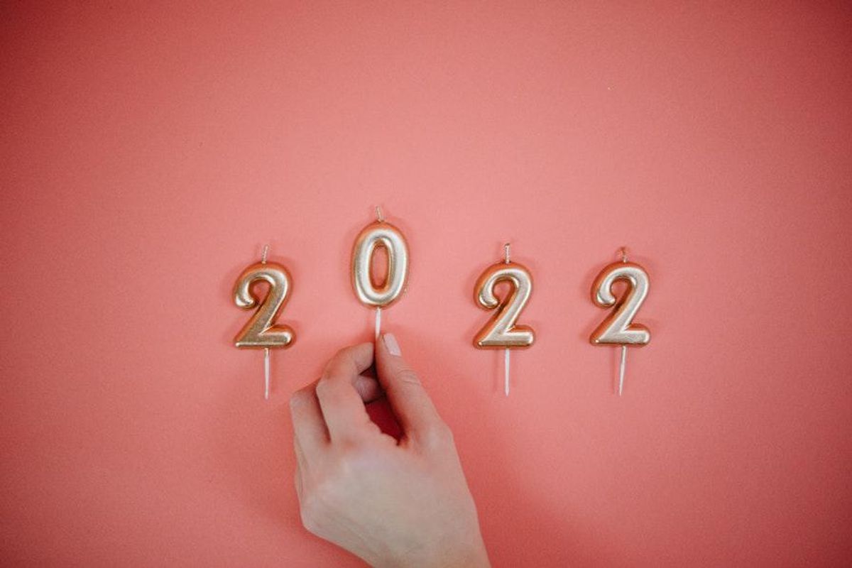 birthday cake candles arranged to read 2022