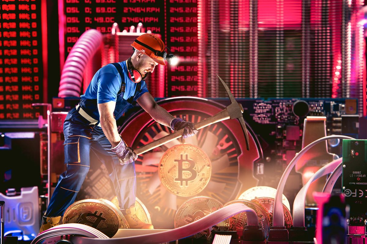 bitcoin miner surrounded by computer hardware