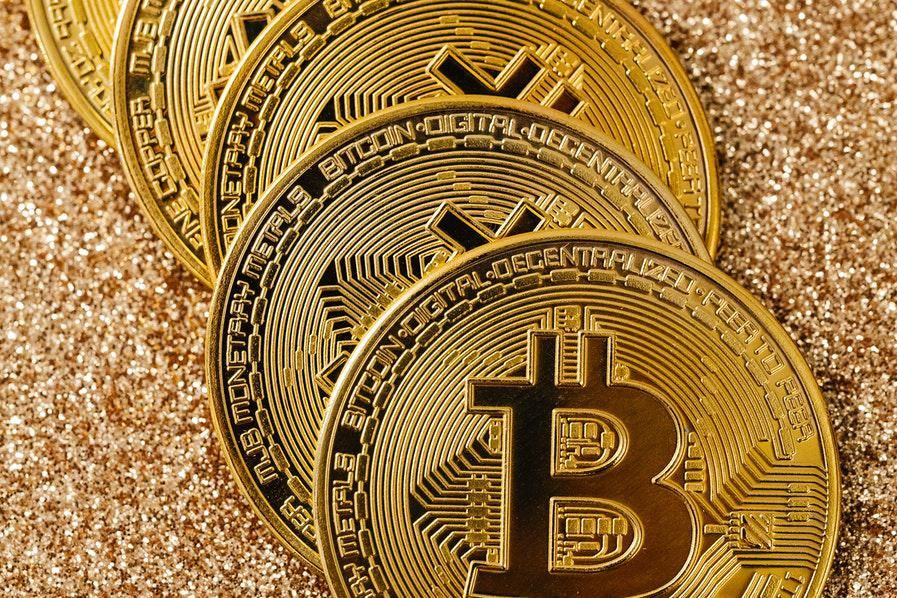 bitcoins against glittery backdrop