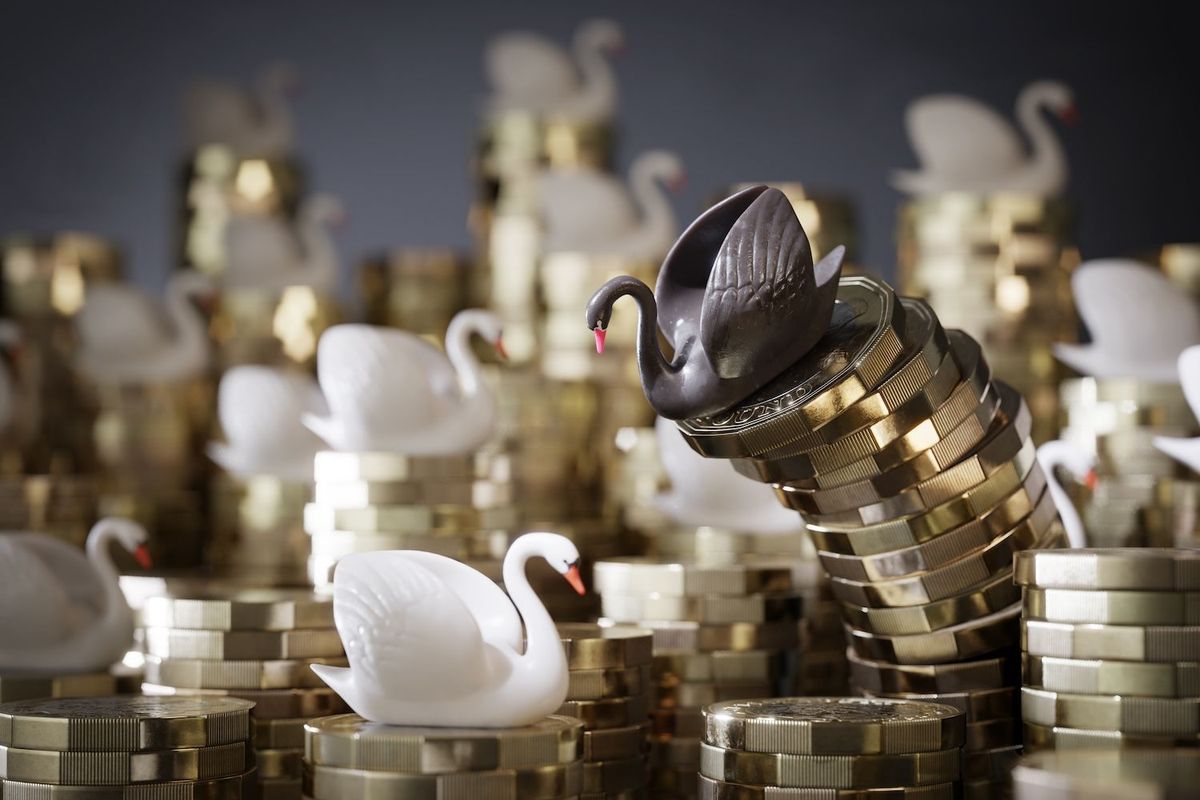 Black swan and many white swans on piles of gold coins.
