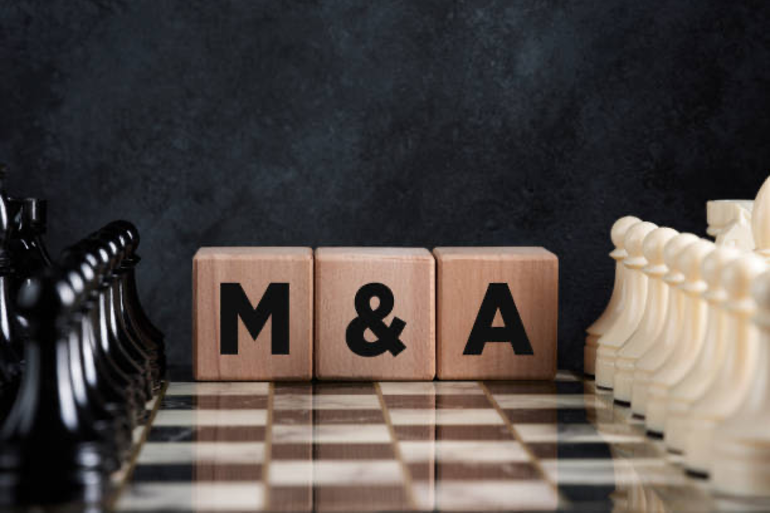 Blocks spelling "M&A" on chess board.