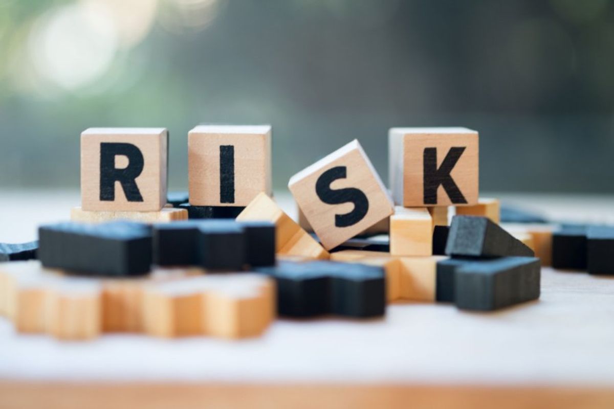 blocks with letters reading R I S K