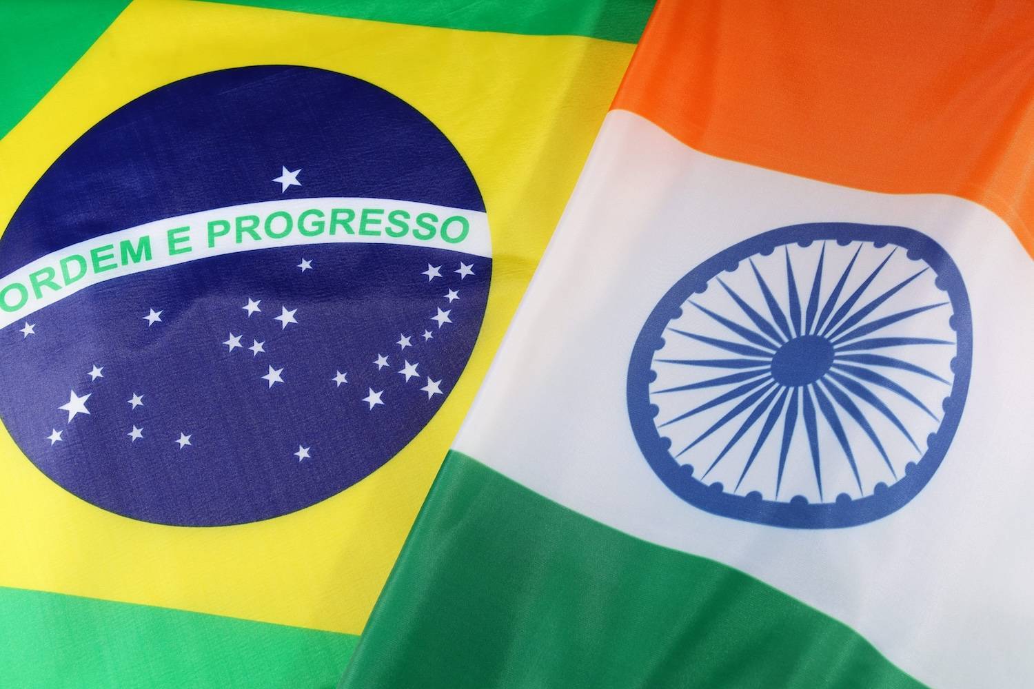 Brazilian and Indian flags side by side, showcasing national symbols and colors.