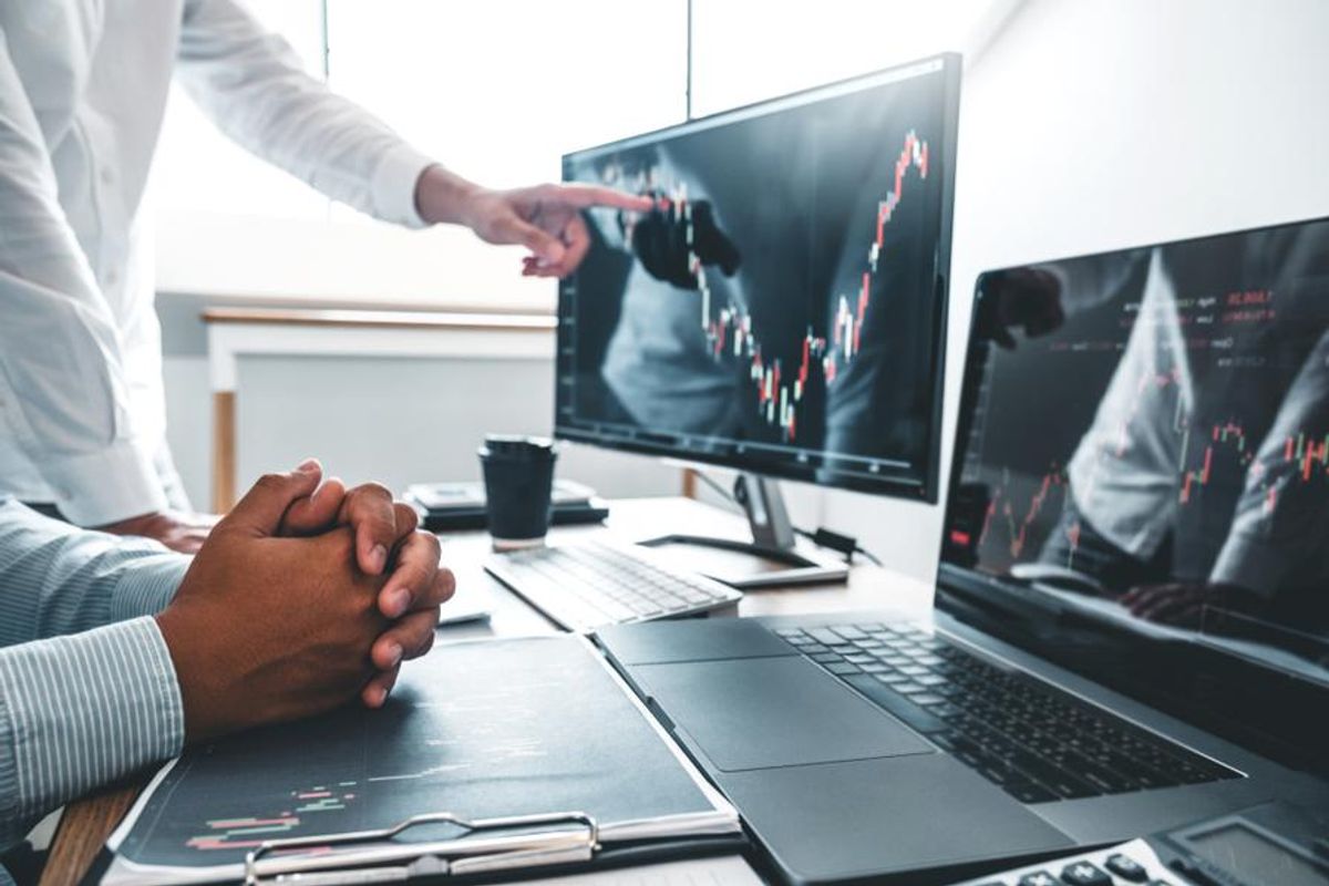 business people examining stock losses