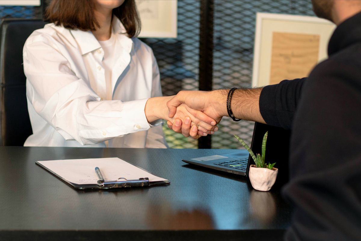 Business people shaking hands.