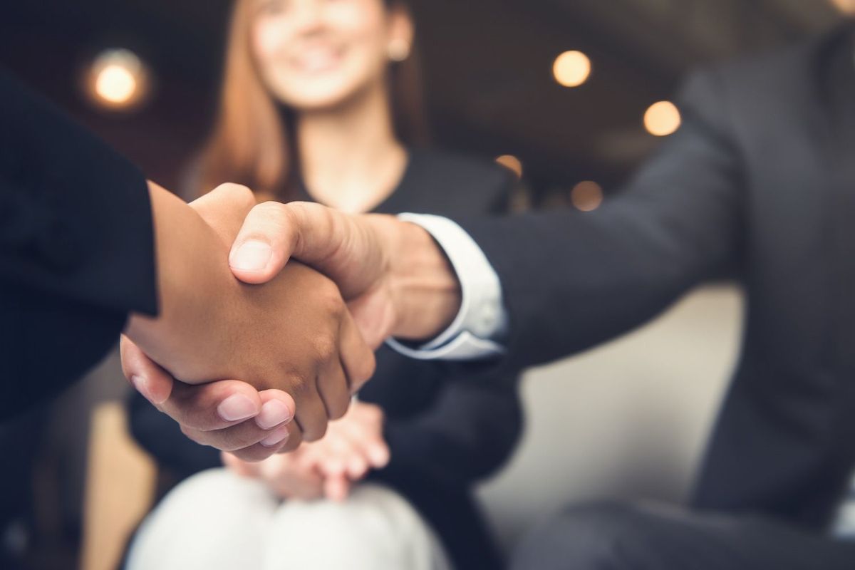 Business people shaking hands.