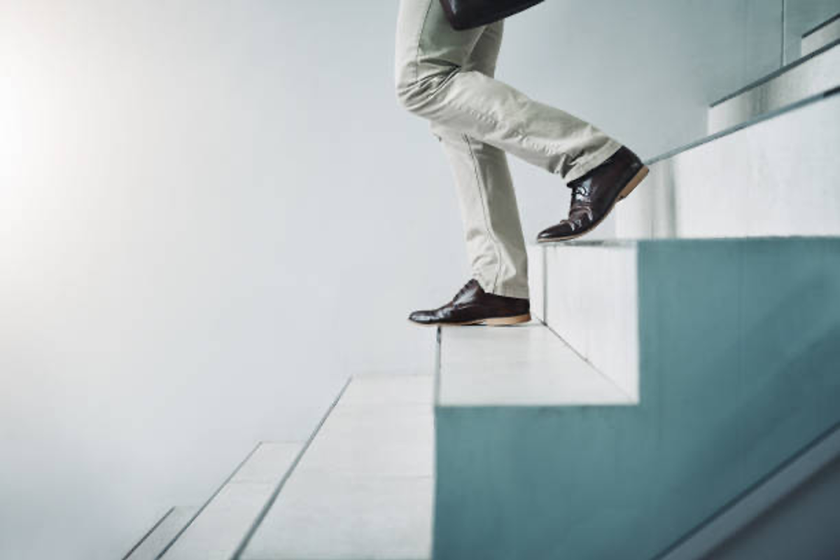 Businessman going down stairs.