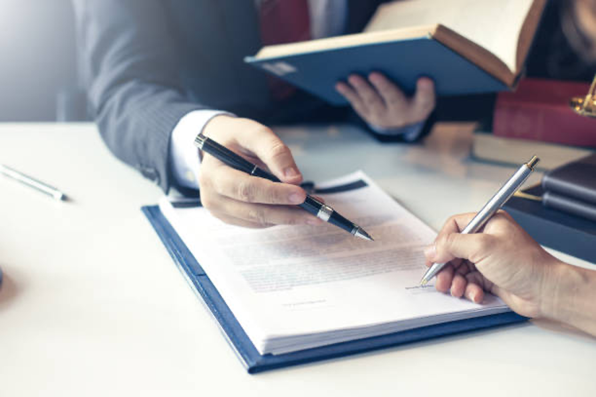 Businessmen signing agreement.