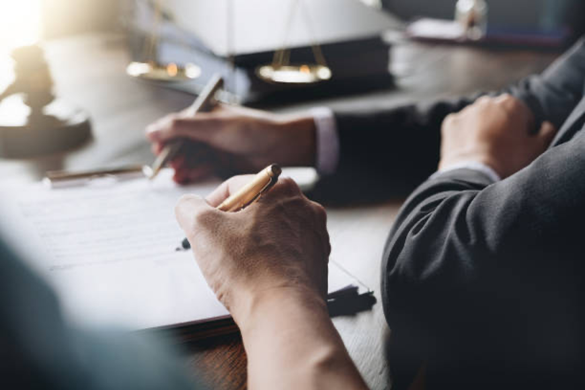 Businessmen signing agreement.