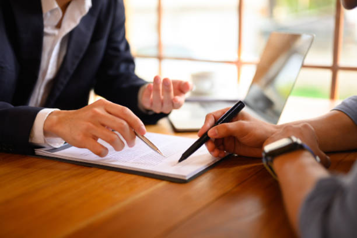 Businessmen signing contract.